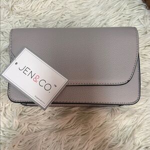 Jen &Co crossbody bag with black and white strap. NWT